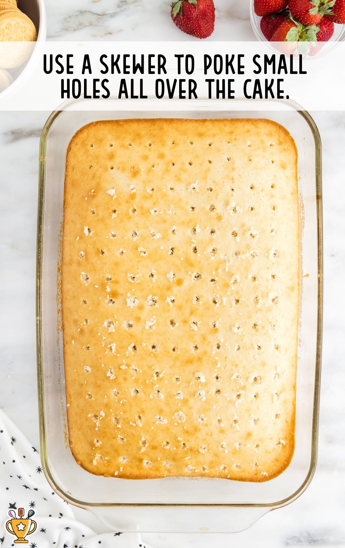 Strawberry Crunch Poke Cake with poked holes