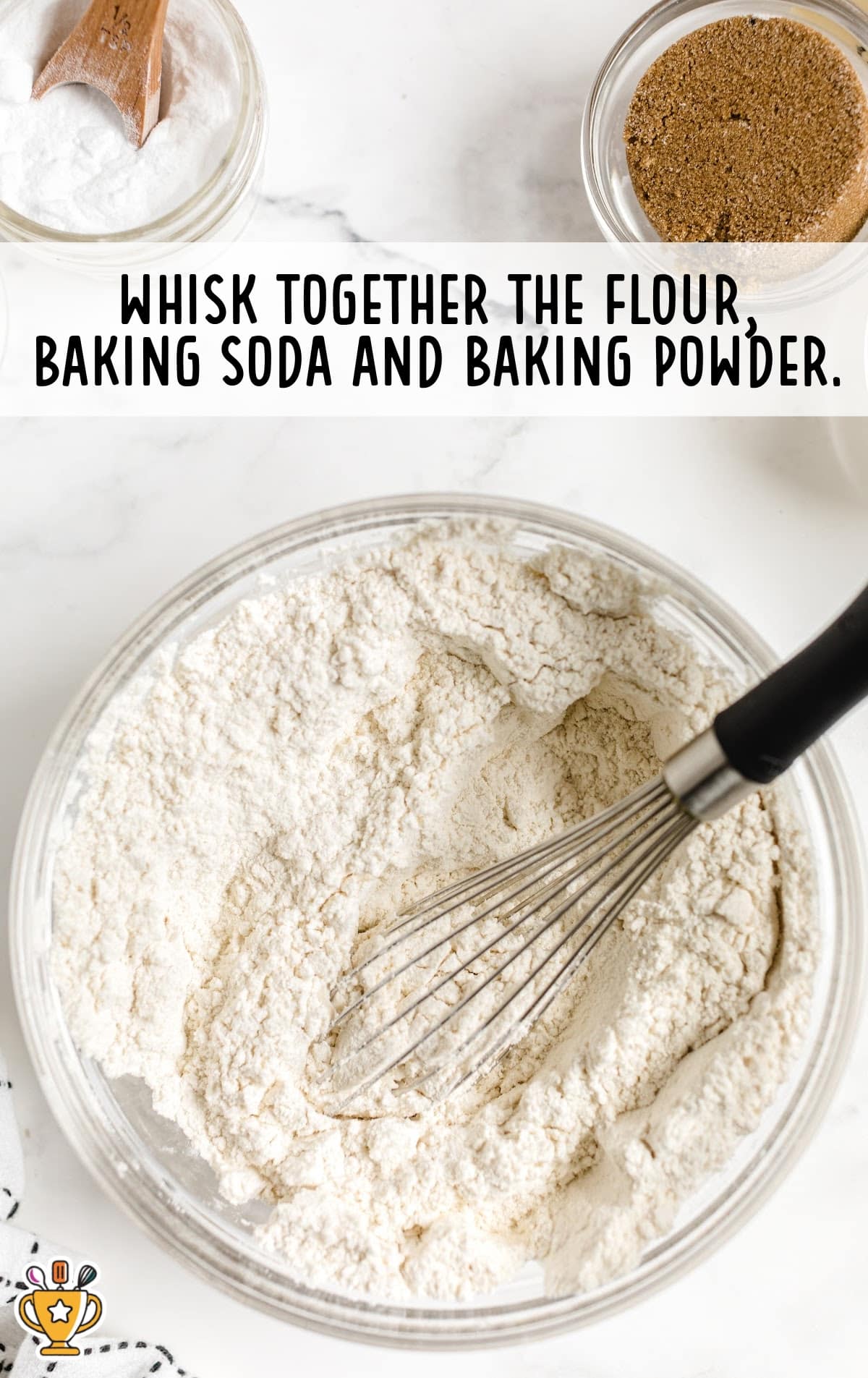 flour, baking soda and baking powder mixed in a bowl