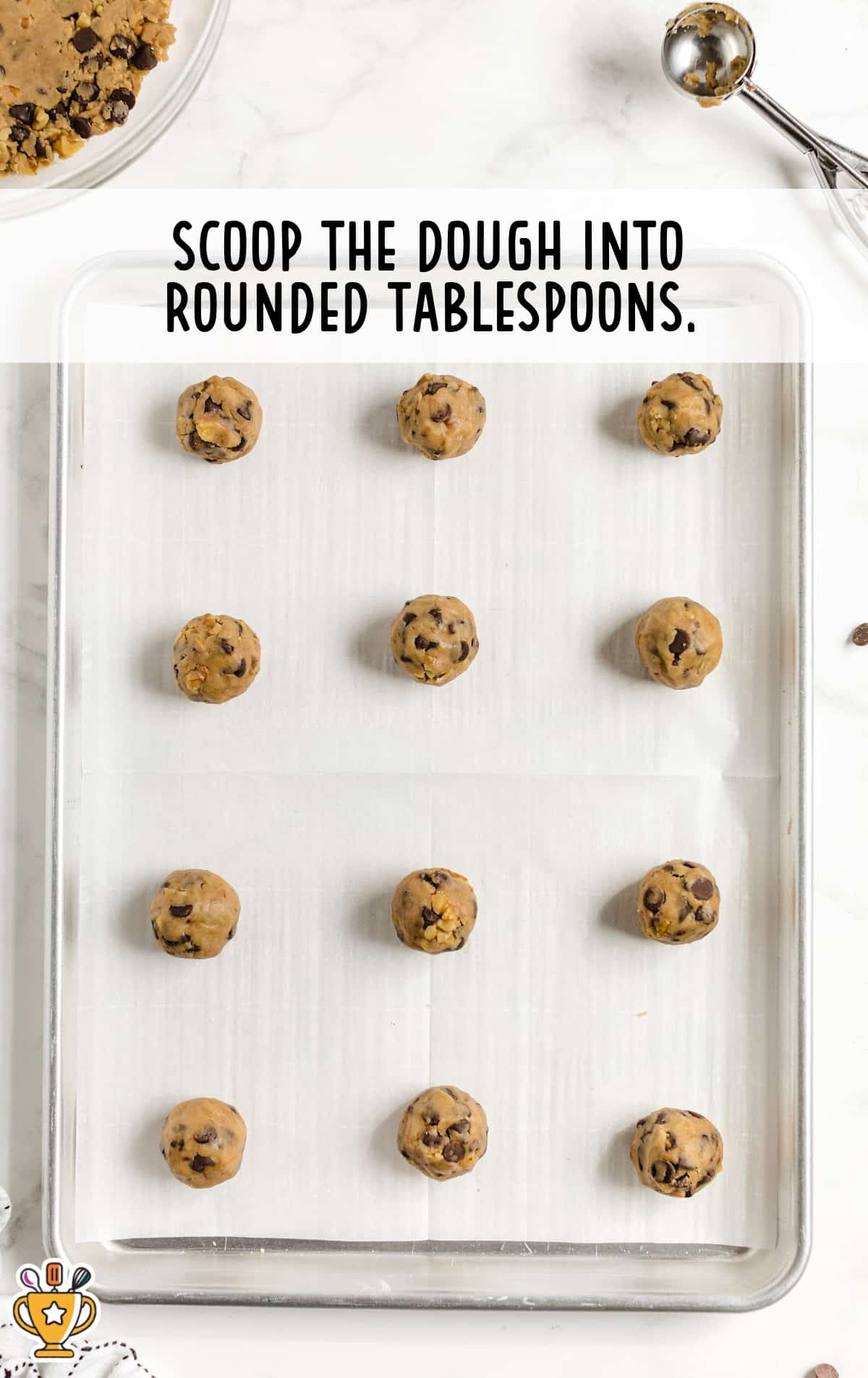 rounded doughs on a baking pan