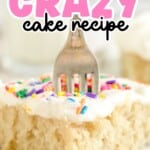 a piece of Vanilla Crazy Cake on a white plate with a fork in it