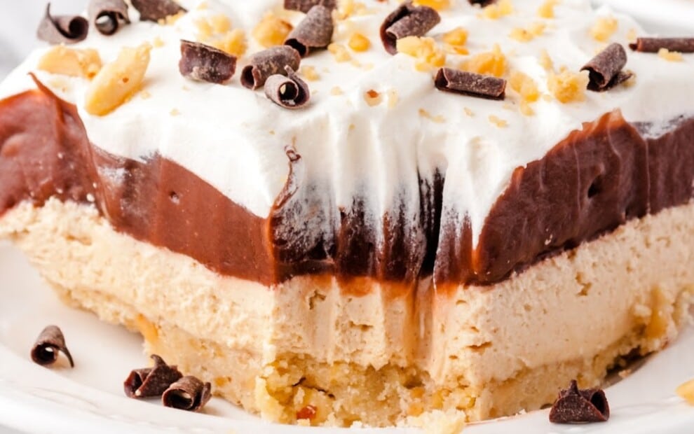 a piece of Chocolate Peanut Butter Lasagna on a white plate