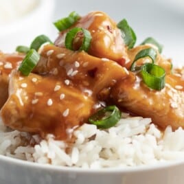 Crockpot Orange Chicken in a bowl served with rice