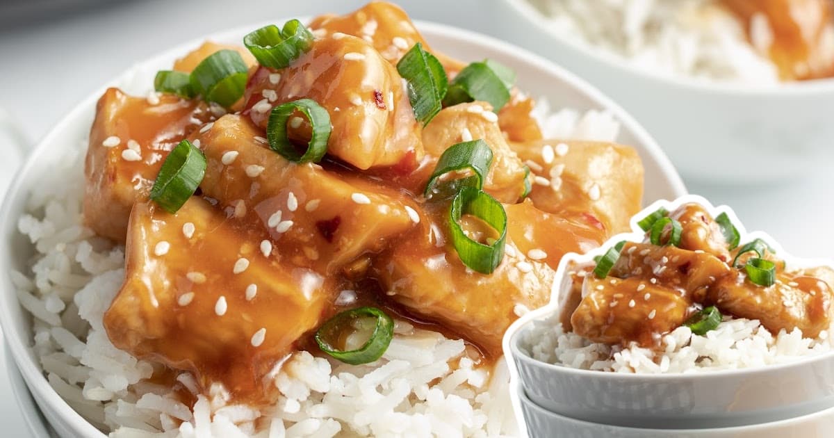 Crockpot Orange Chicken in a bowl served with rice