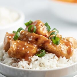 Crockpot Orange Chicken served with rice in a bowl