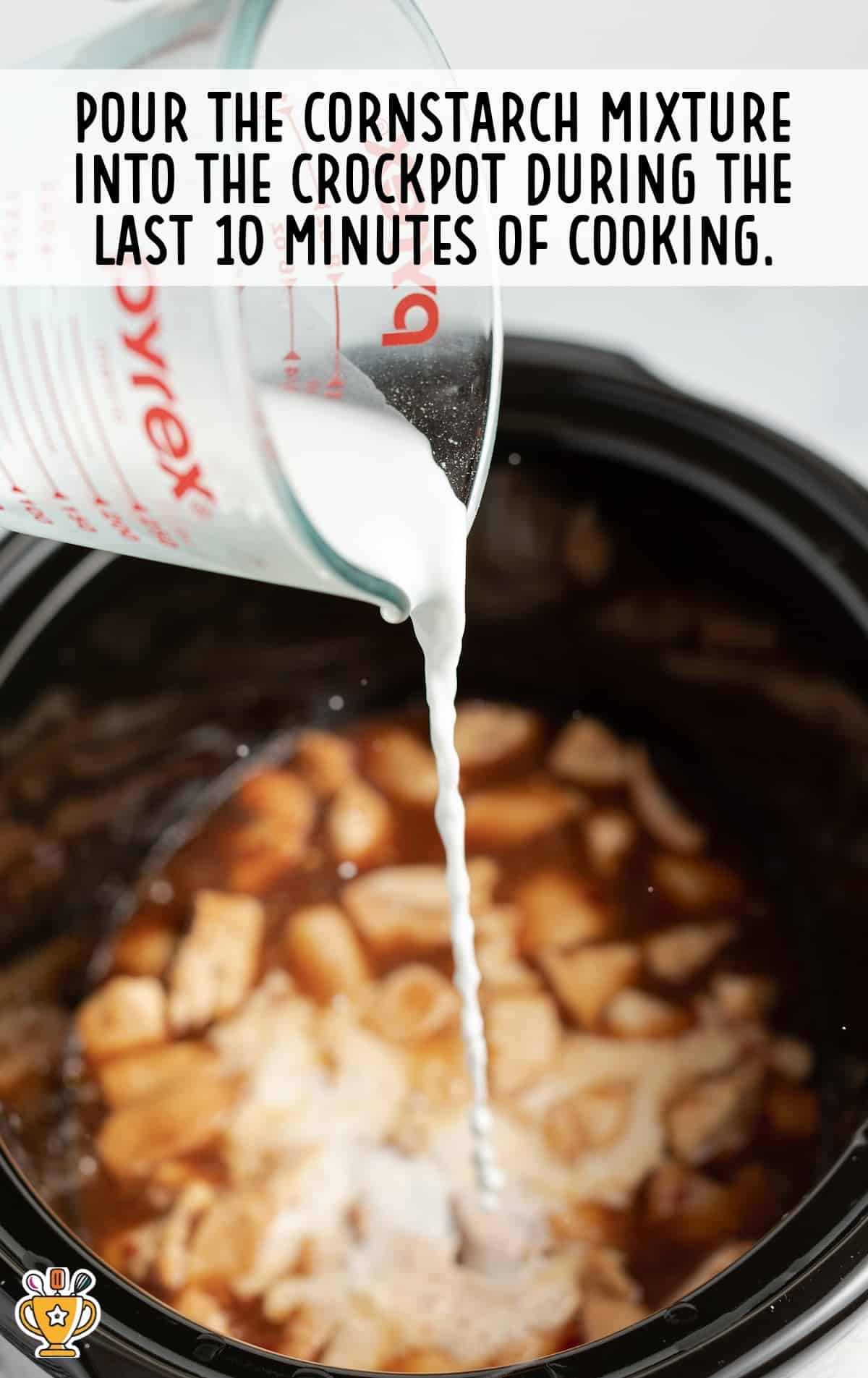 pouring corn starch mixture into the crockpot