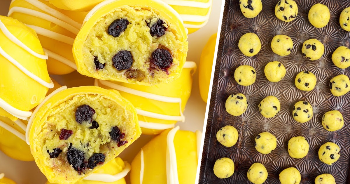 a bunch of Lemon Blueberry Cheesecake Bites, one cut into half