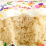 a piece of Vanilla Crazy Cake with a bite on it