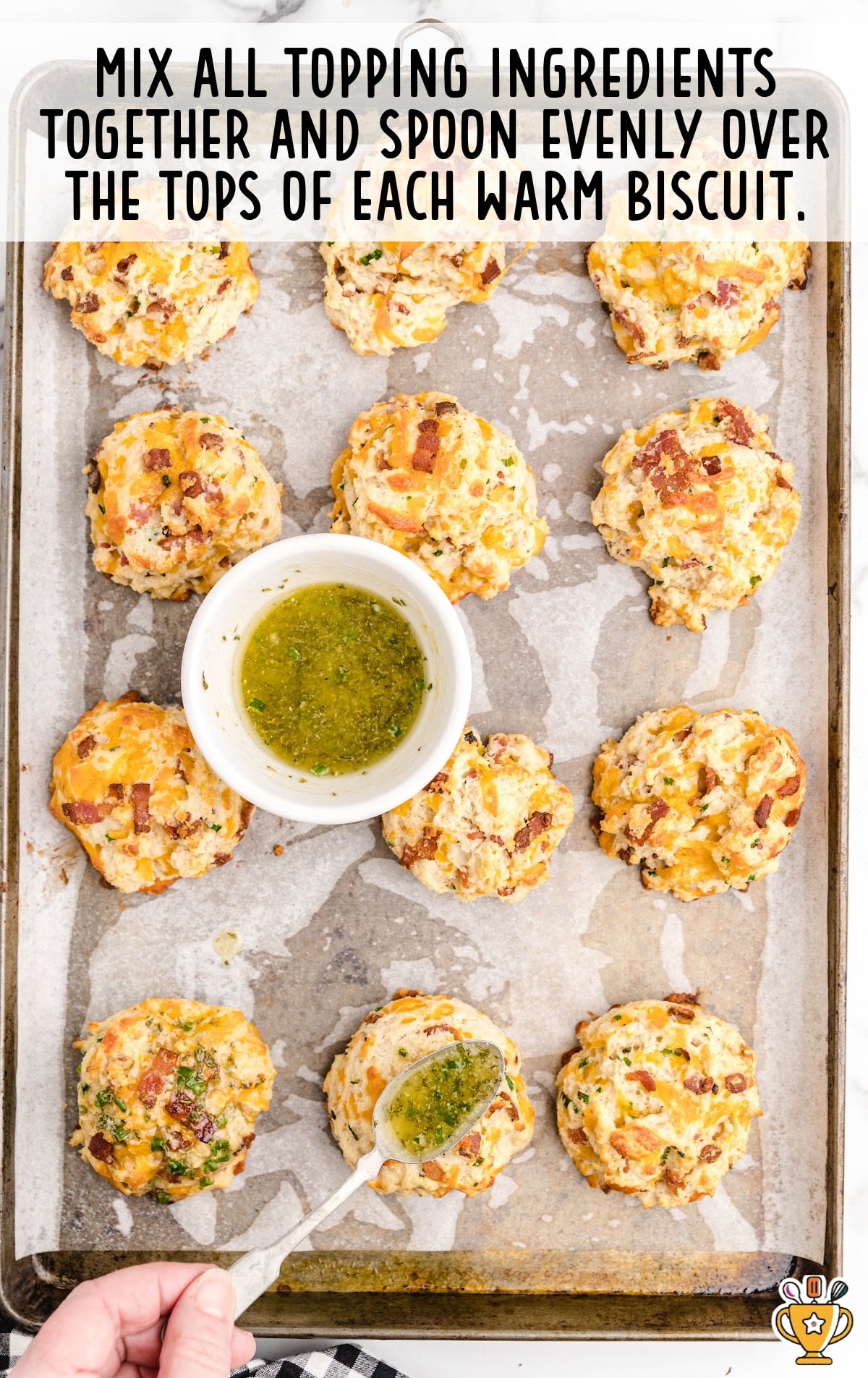 mixing the topping ingredients together over the tops of warm biscuits