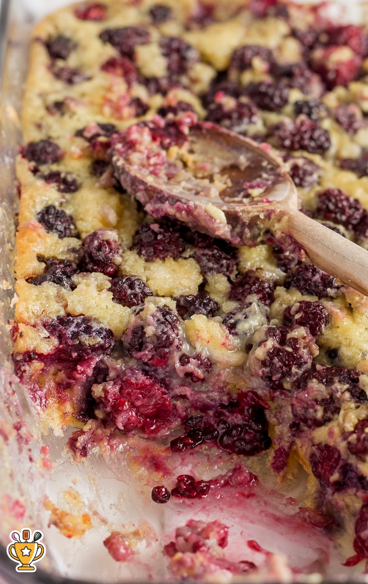 Side-by-side dishes of blackberry cobbler showing scooped portions with juicy blackberry filling.