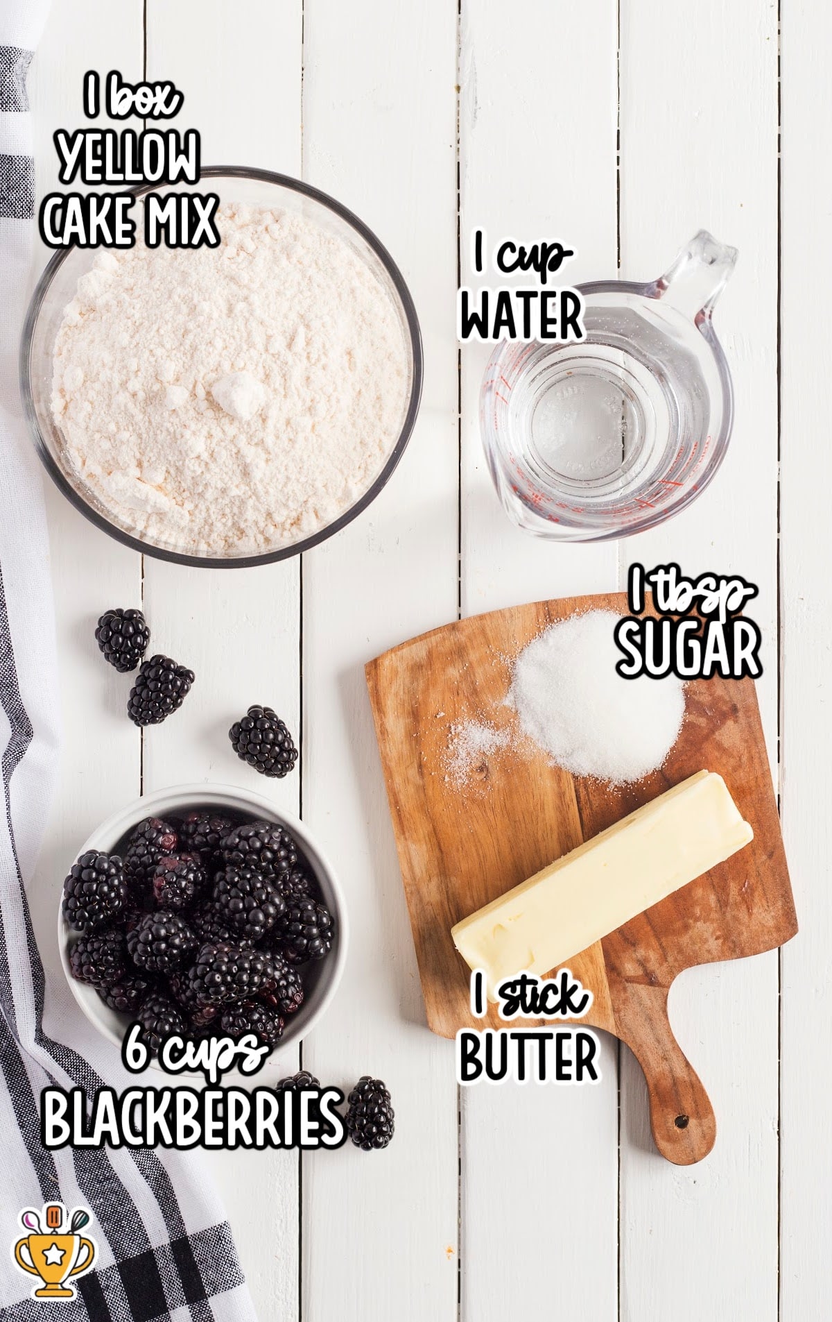 Overhead view of blackberry cobbler ingredients: yellow cake mix, blackberries, butter, sugar, and water.