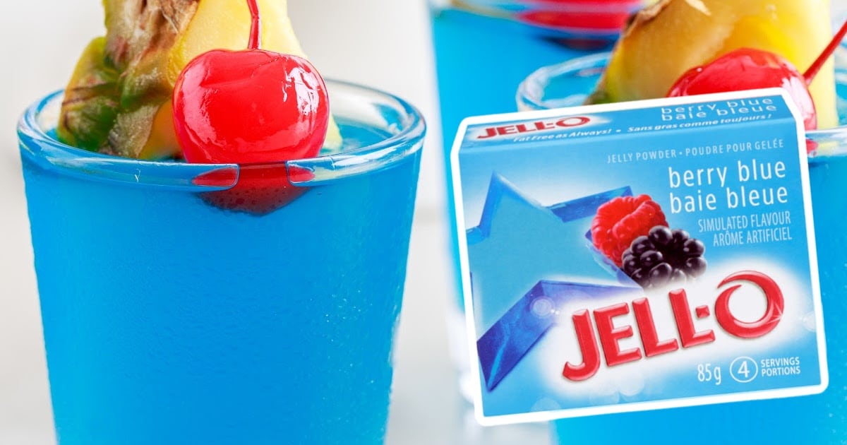 a glass of Blue Hawaiian Jello and a box of jello on the side