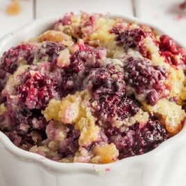 Golden baked blueberry cobbler with bursts of fresh berries and crisp cake edges