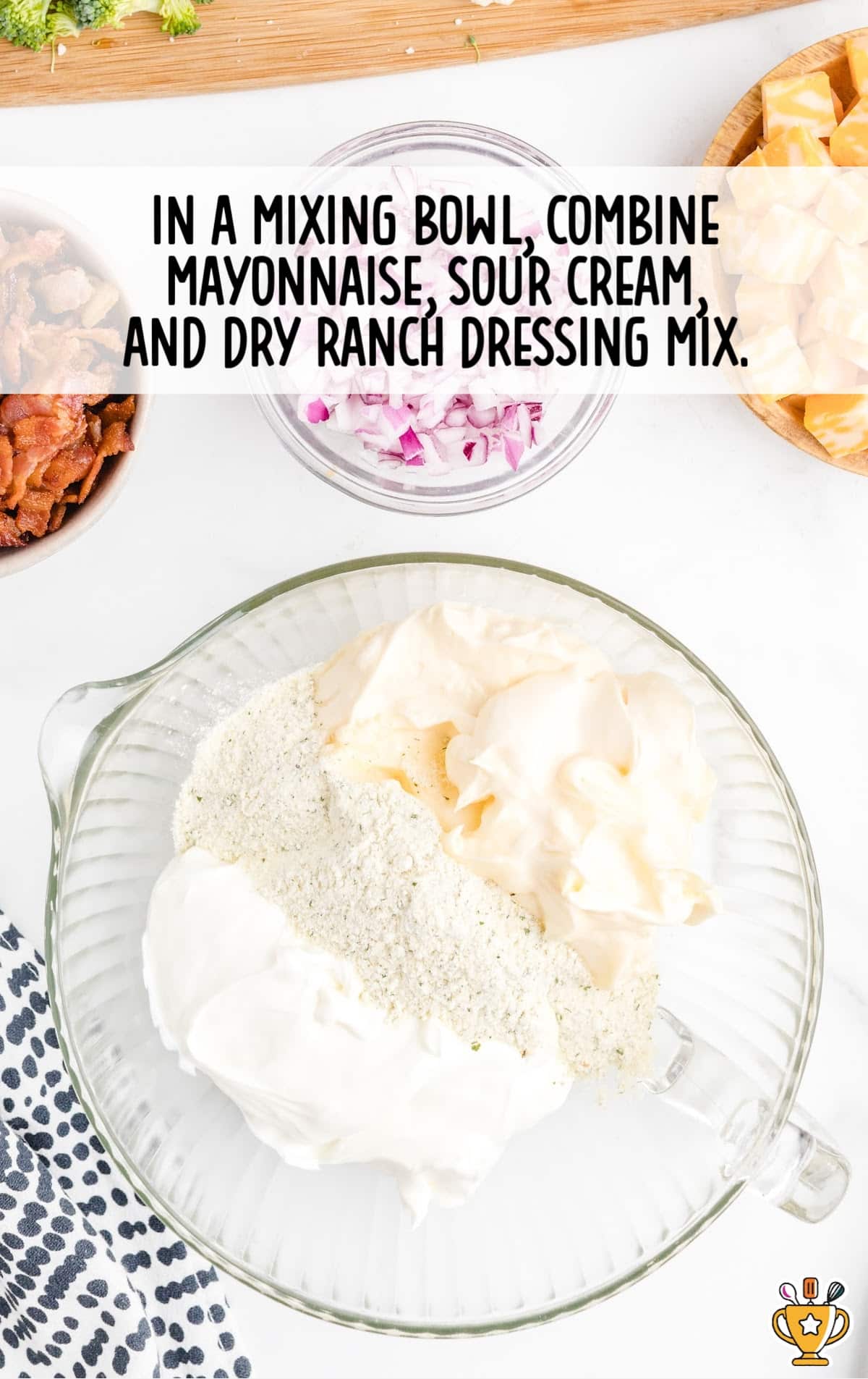 mayonnaise, sour cream and dry ranch dressing mix mixed in a bowl
