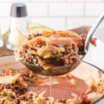 a serving spoon holding some Cabbage Roll Soup