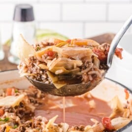 a serving spoon holding some Cabbage Roll Soup