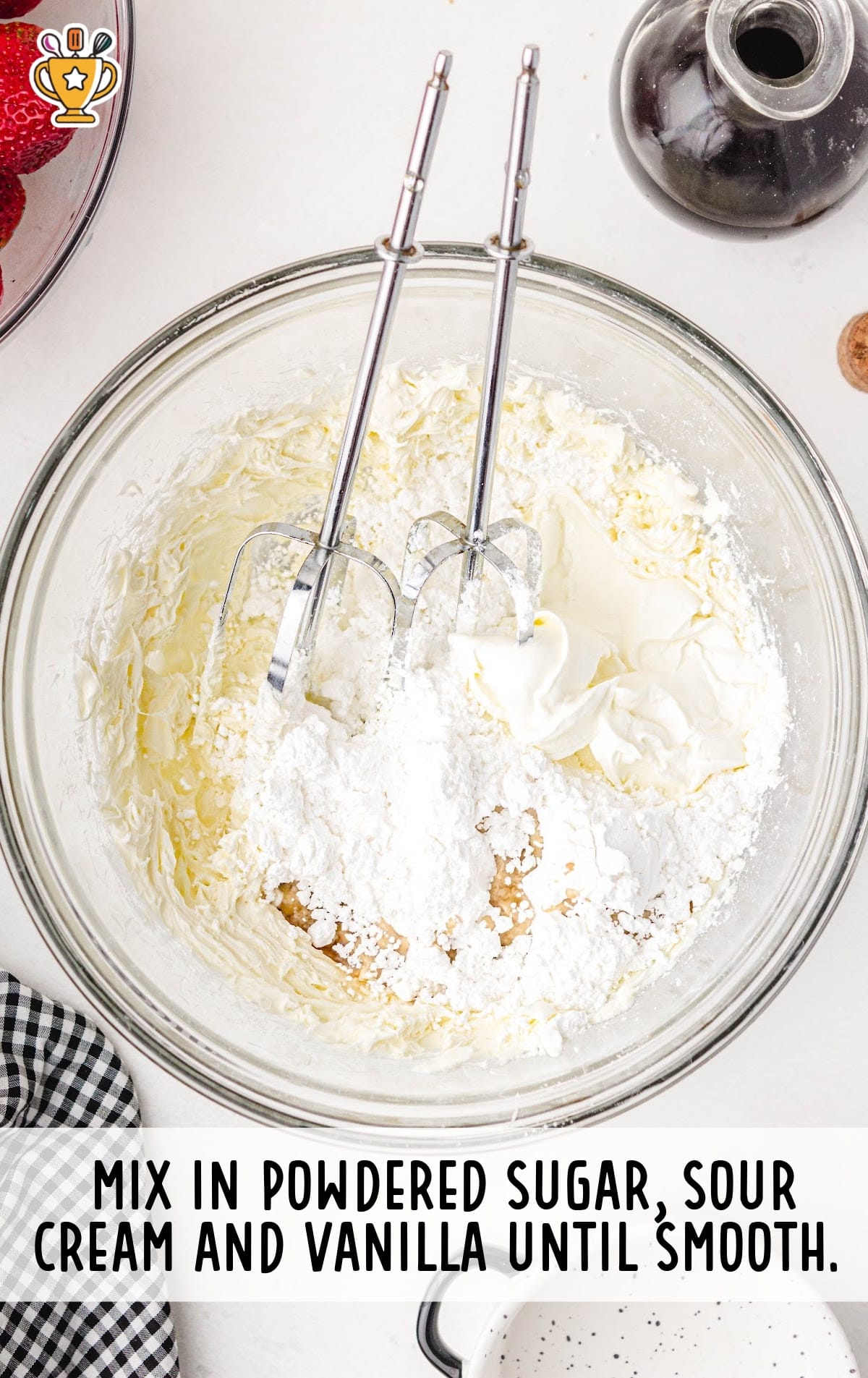 powdered sugar, sour cream and vanilla mixed in a bowl