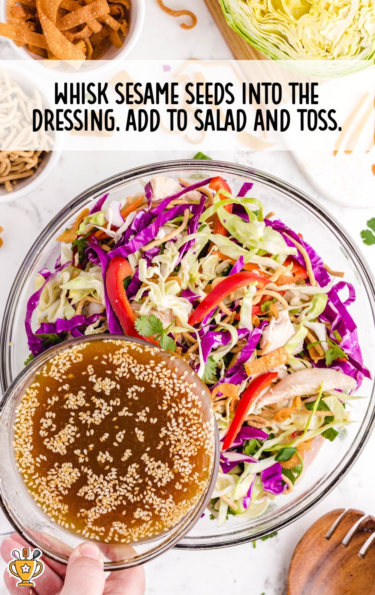 whisking sesame seeds into the dressing and adding to the salad