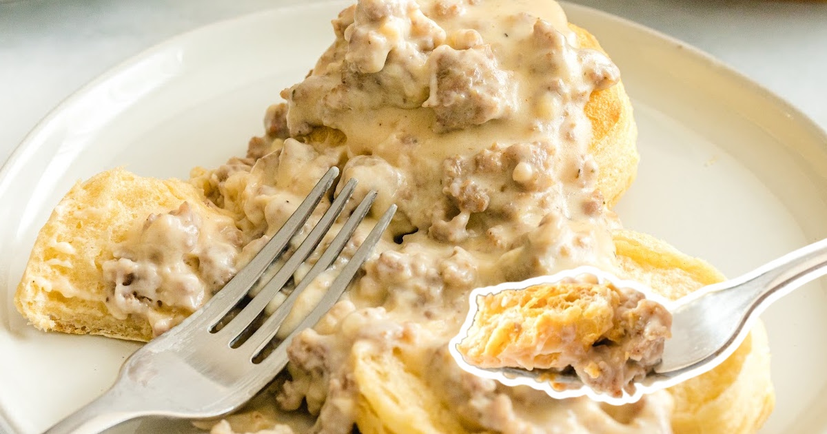 Country Biscuits and Sausage Gravy served on a plate with two forks