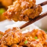 &ldquo;Honey chicken piece held with chopsticks above a bowl of crispy chicken and dipping sauce. Text reads: Easy Deep Fried Recipe.&rdquo;