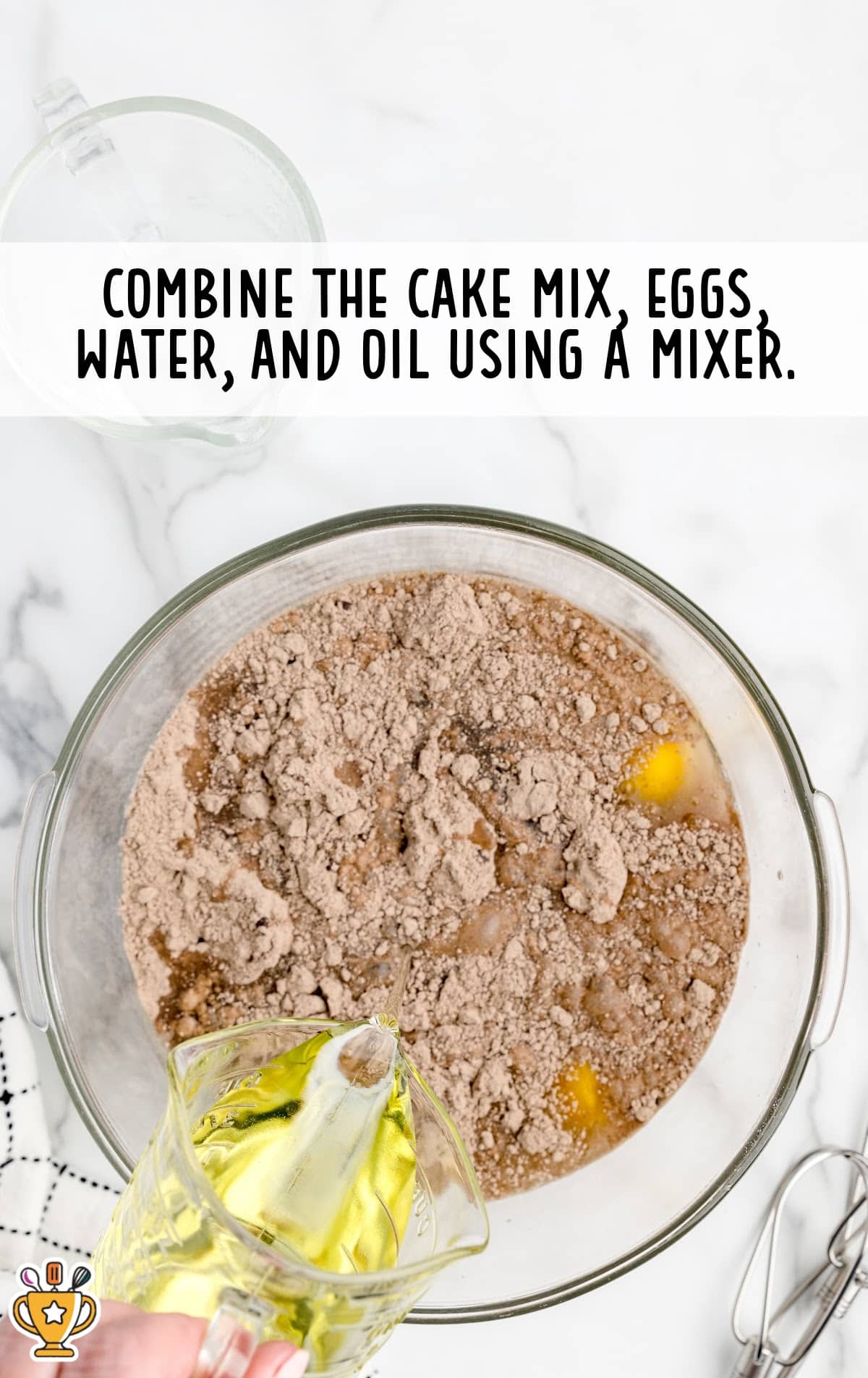 cake mix, eggs, water and oil combined in a bowl