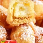 a bunch of Fried Cheesecake, one with a bite on it