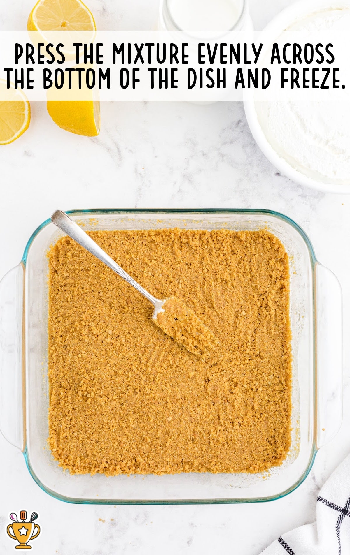 pressing the mixture at the bottom of the dish