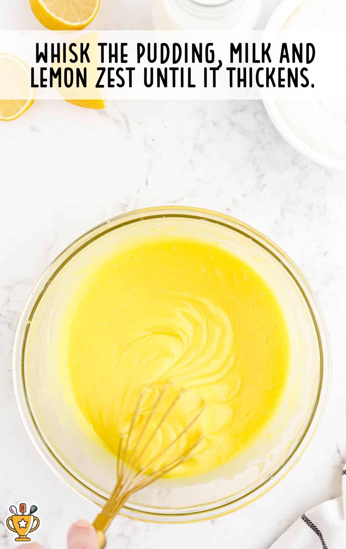 whisking the pudding, milk and lemon zest in a bowl