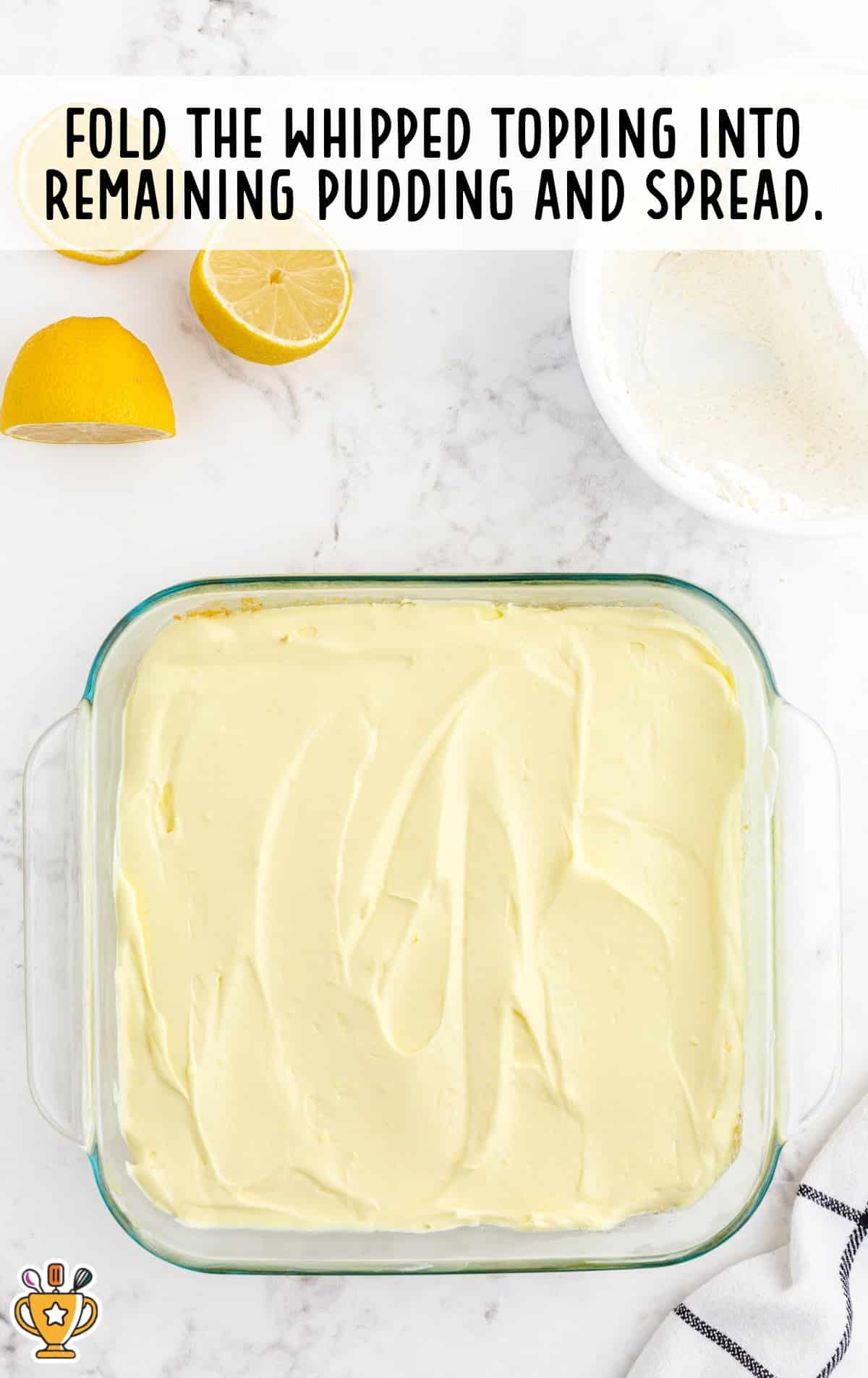 whipped topping on pudding in a baking dish