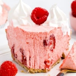 a piece of No Bake Raspberry Pie on a white plate