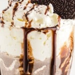 a glass of Oreo Milkshake with a cookie in it