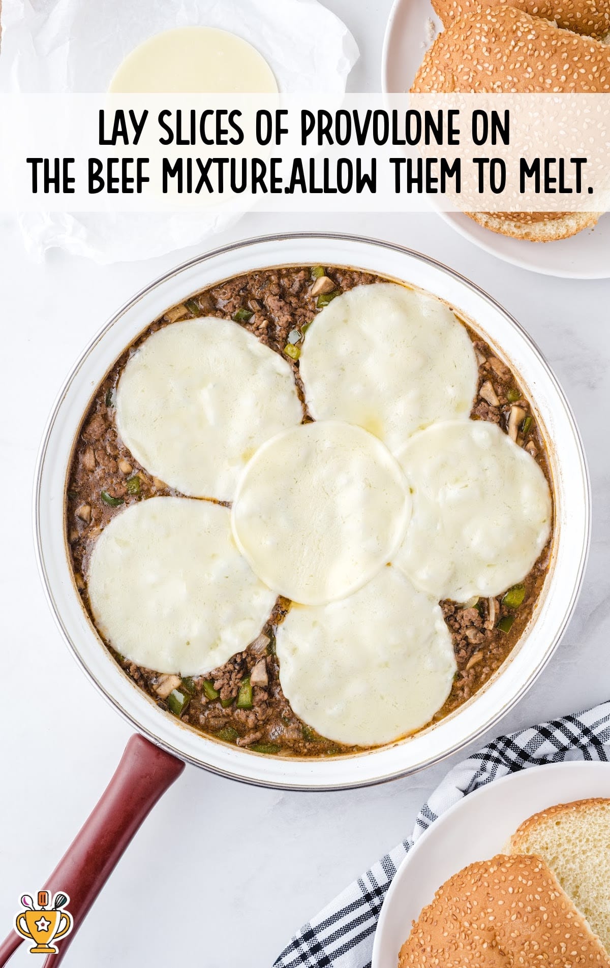 slices of provolone on the beef mixture