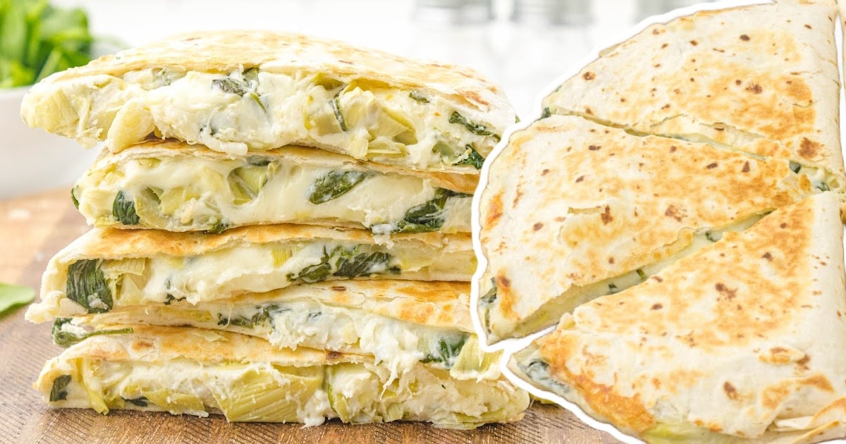 a stack of Spinach Artichoke Quesadilla pieces on a wooden board
