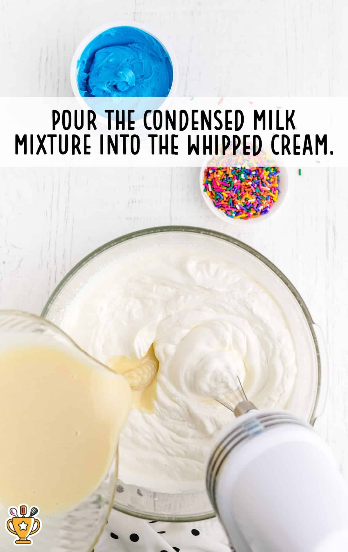 condensed milk mixture poured into the whipped cream