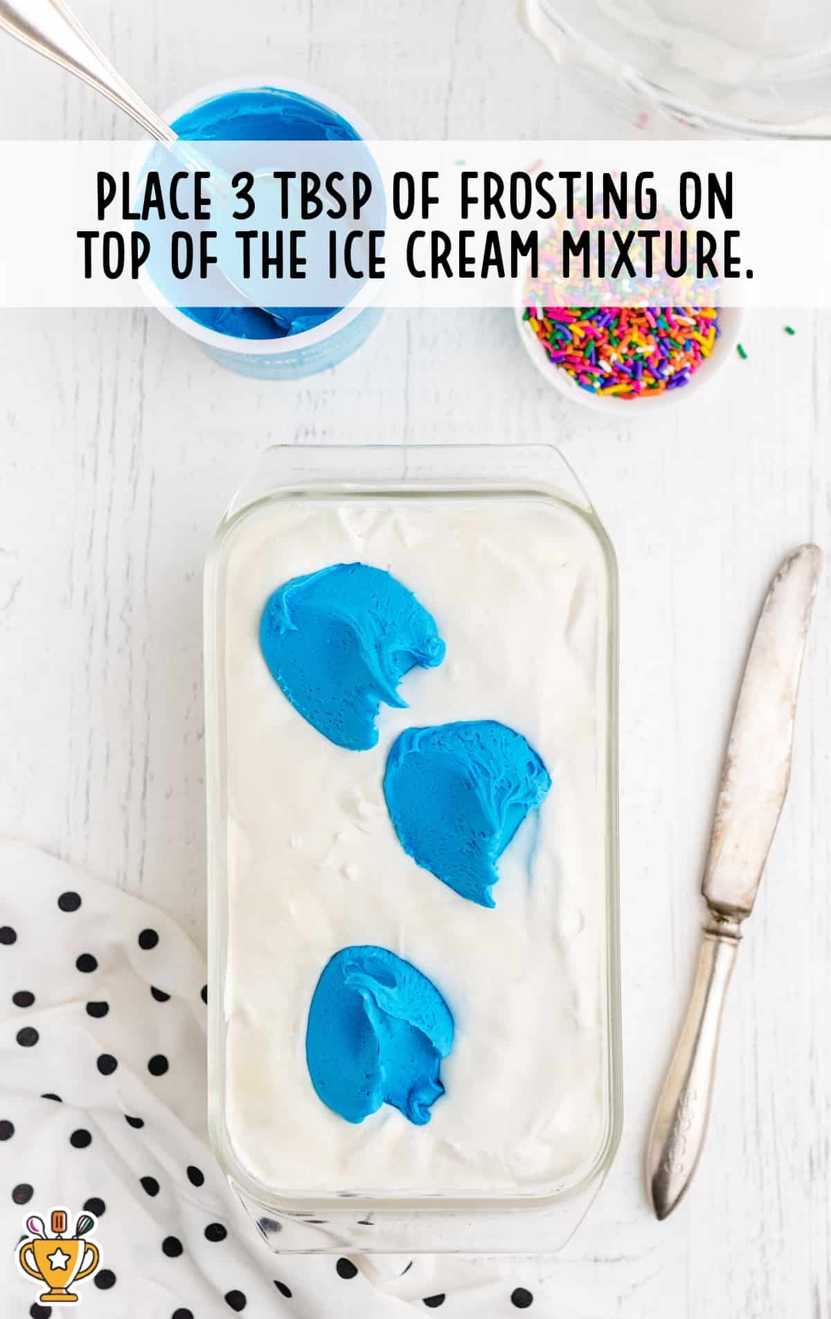3 tbsp of frosting placed on top of the ice cream mixture