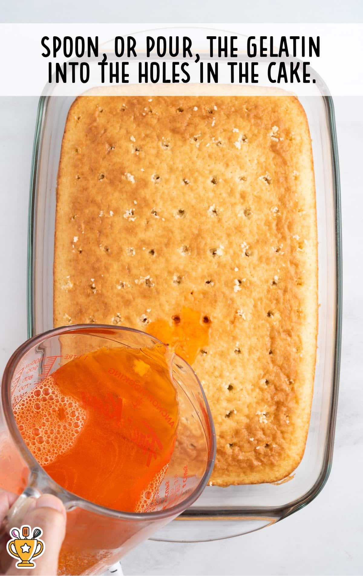 pouring gelatin into holes in the cake