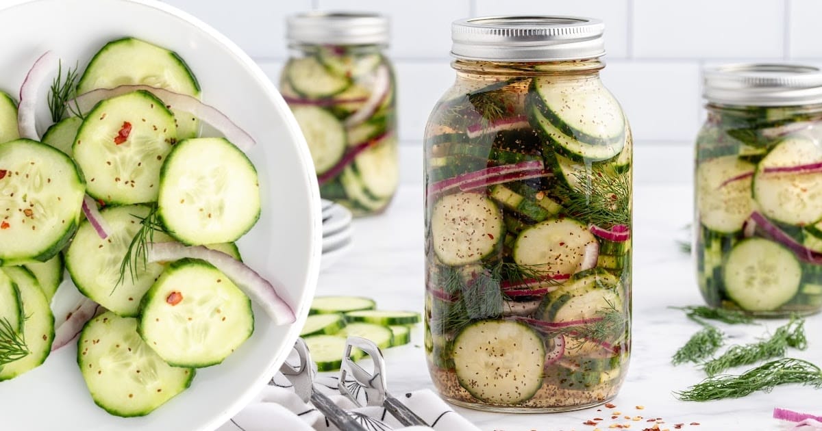 Mason jar of cucumber salad with overlay text reading "Pickled Cucumber Salad – Fresh and So Simple!"