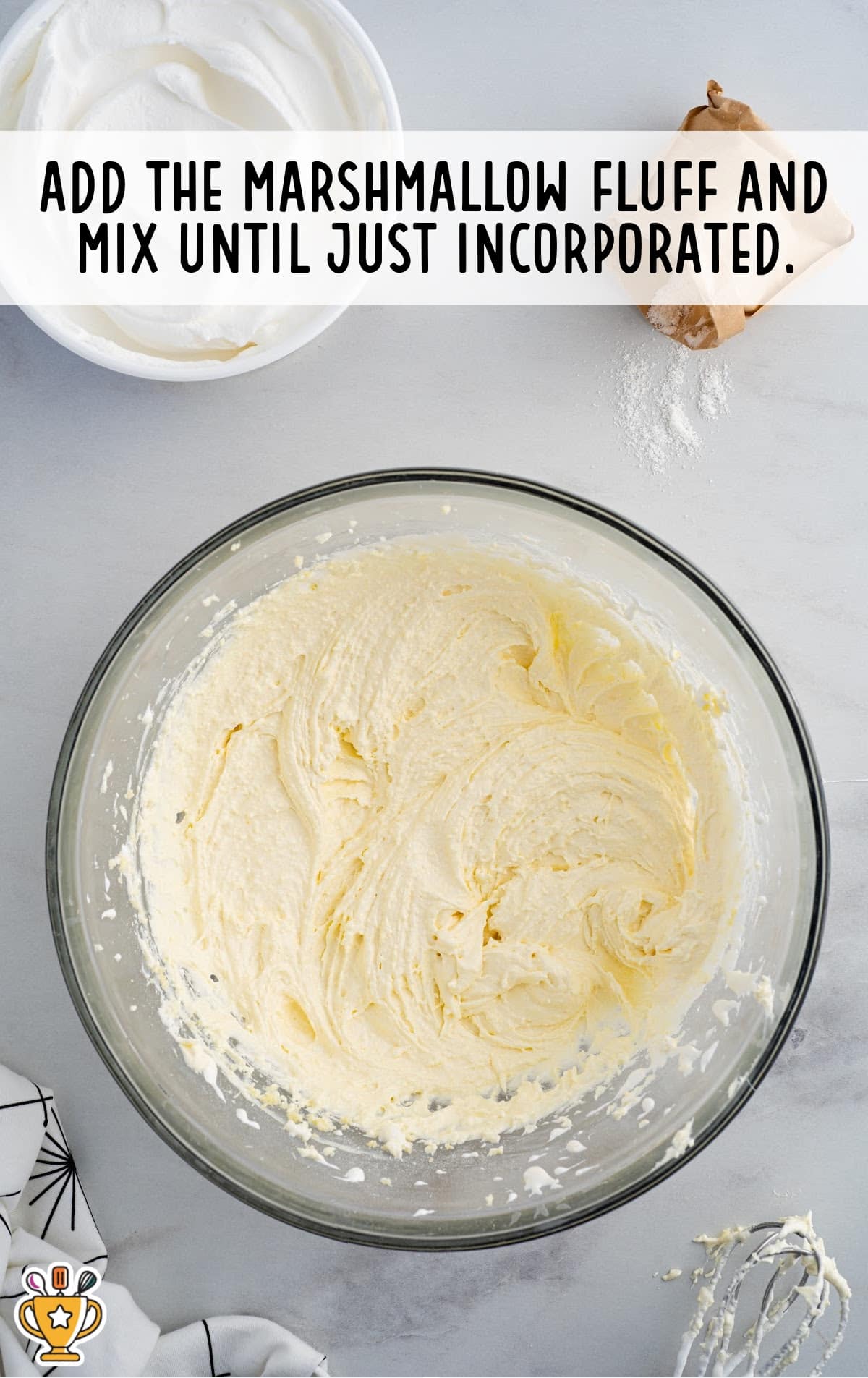 marshmallow fluff added to a bowl
