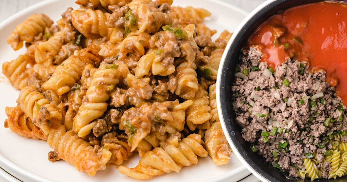 Plate of Amish casserole next to a pot of ingredients including ground beef, diced peppers, and tomato soup.