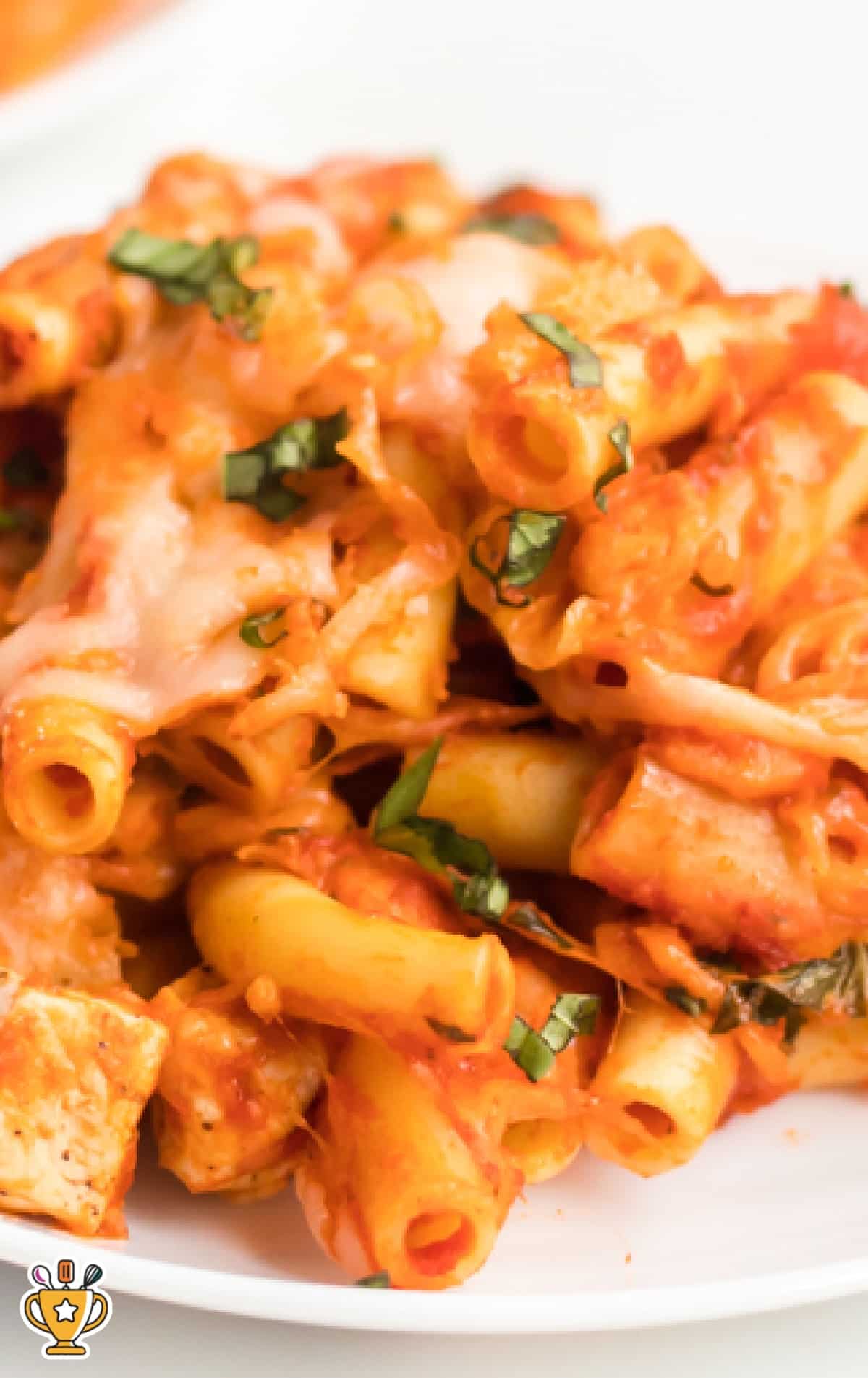 Text overlay image showing a close-up of baked ziti with chicken and basil, with &ldquo;Baked Ziti with Chicken&rdquo; and &ldquo;Perfect Family Dinner!&rdquo; written across the top and bottom.
