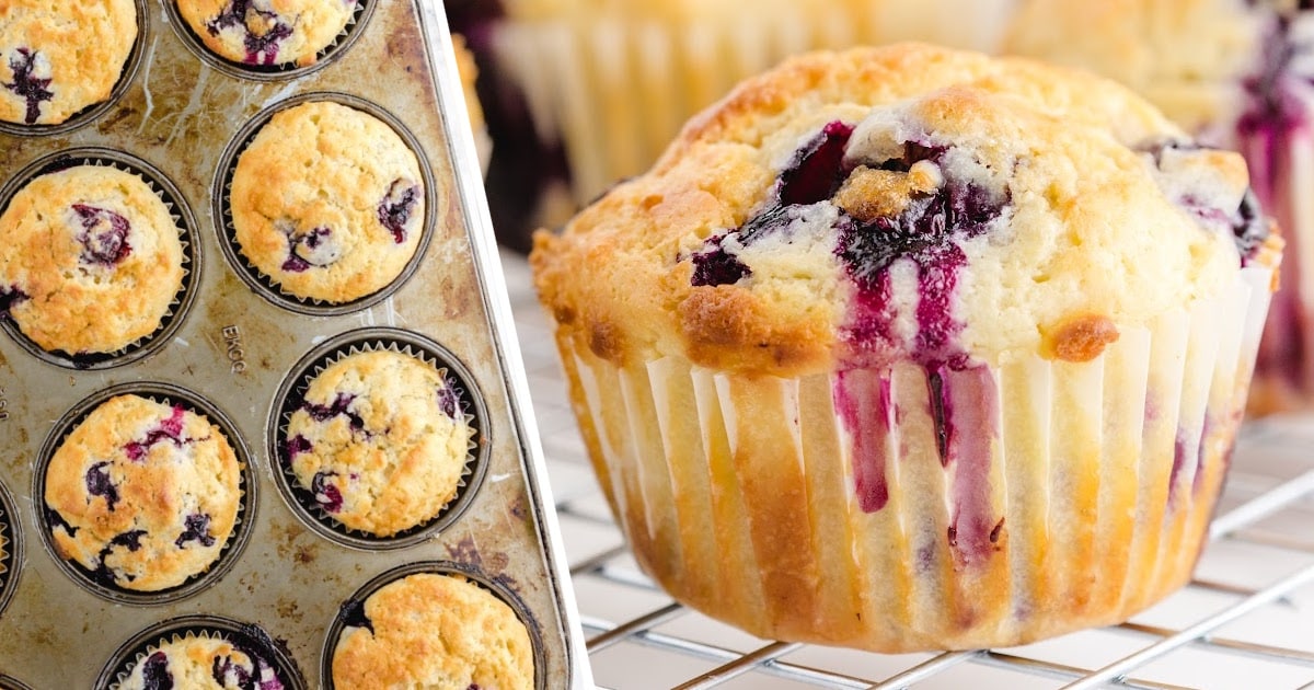 Freshly baked blueberry muffins in a metal muffin tin next to a close-up of one muffin on a cooling rack.