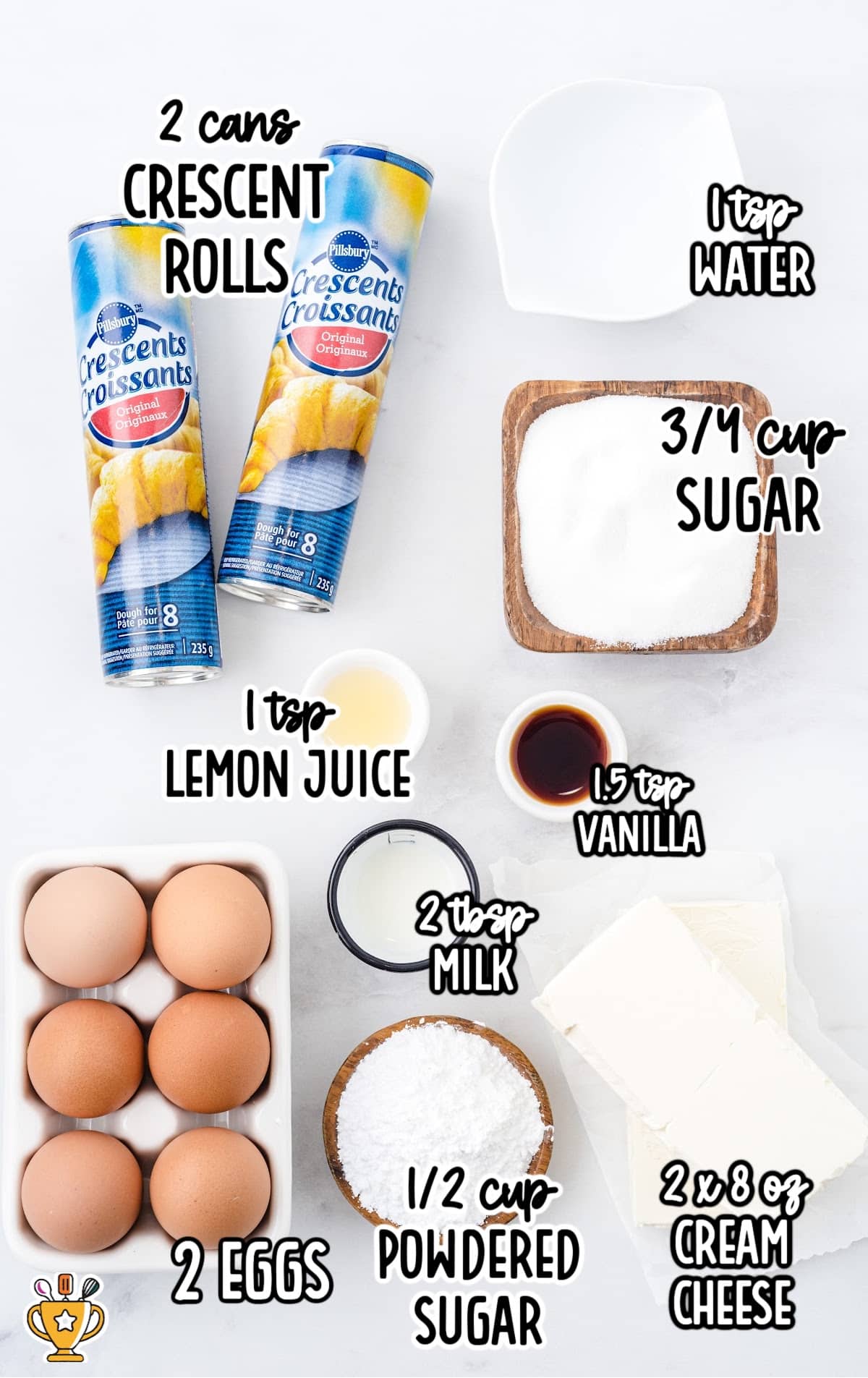 Flat lay of labeled cheese danish ingredients including crescent rolls, cream cheese, eggs, vanilla, sugar, and lemon juice.