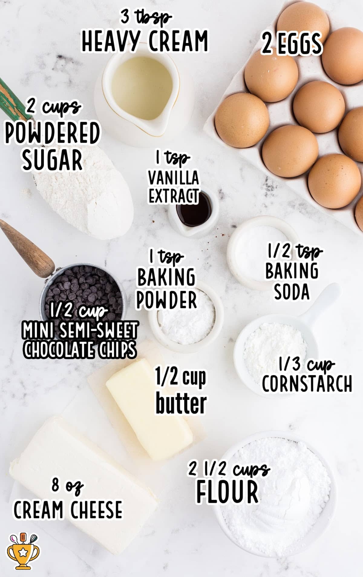 Flat lay of measured ingredients including cream cheese, flour, eggs, powdered sugar, and chocolate chips for cookies.