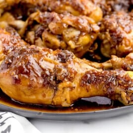 Close-up of glazed Coca-Cola chicken drumsticks with a thick sauce and red overlay text that reads “Coca Cola Chicken - Sticky and Sweet!” and “Best Blog Recipes” in the corner.