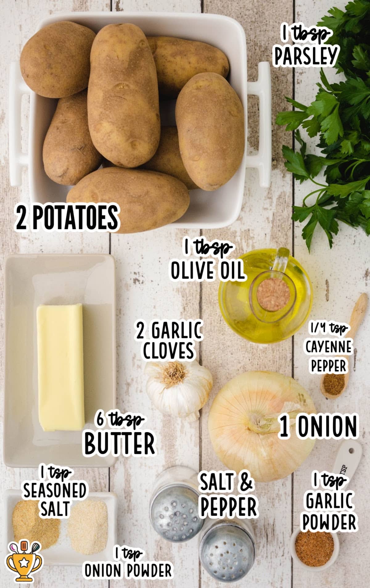 Flat lay of raw ingredients for crispy fried potatoes including russet potatoes, garlic, onion, butter, olive oil, parsley, and seasonings labeled with measurements.