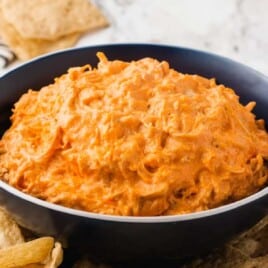 A visual recipe card featuring crockpot buffalo chicken dip with labeled ingredients, step-by-step instructions, and a photo of the finished dip.