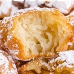 Tall pin graphic with funnel cake bites covered in powdered sugar, showcasing a soft interior and bold text describing it as bite-size fair food.