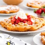 Funnel cake recipe card showing ingredients like flour, eggs, and powdered sugar with a photo of the finished funnel cake.