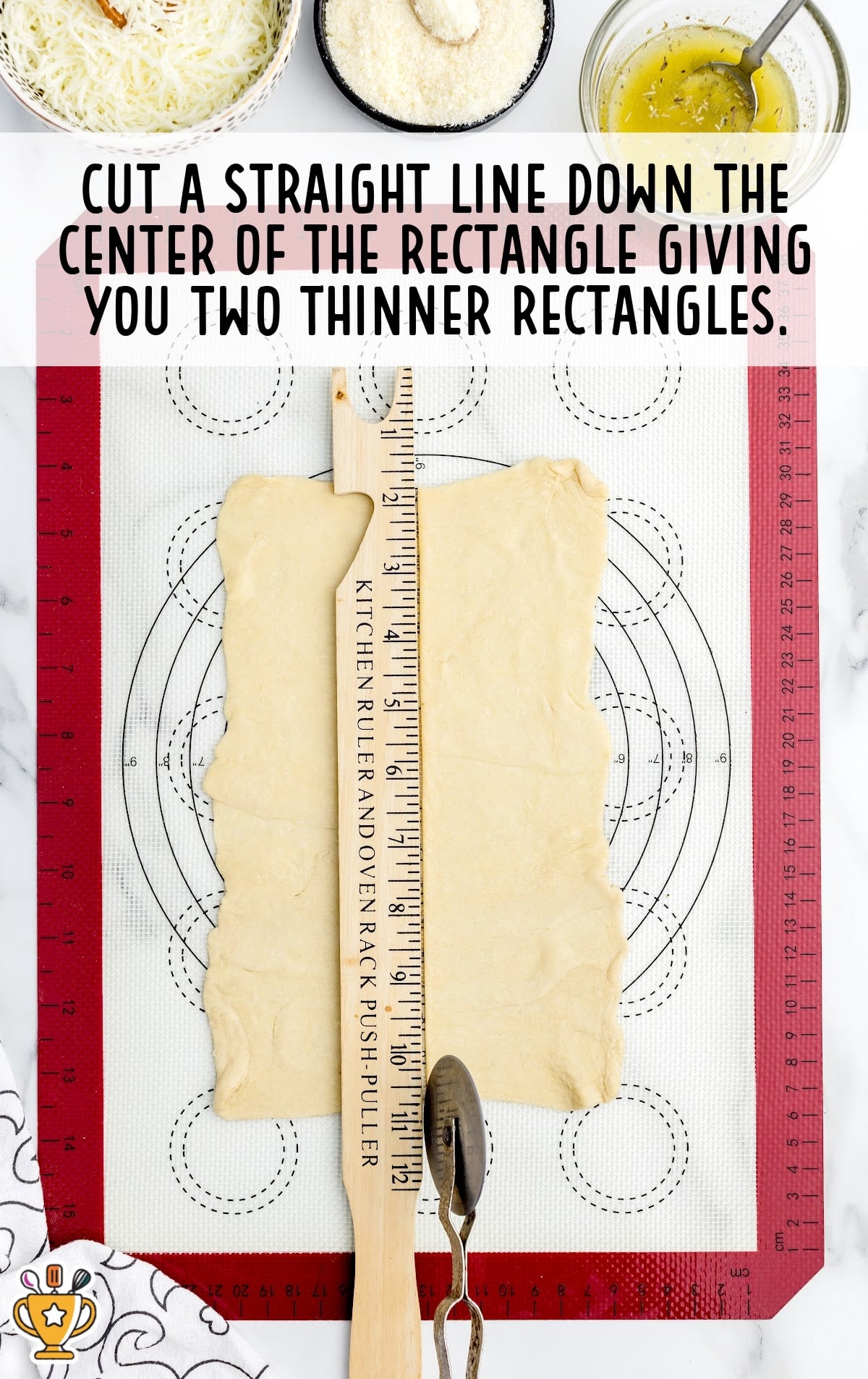 Rolling pin and kitchen ruler next to crescent dough cut into two long rectangles.