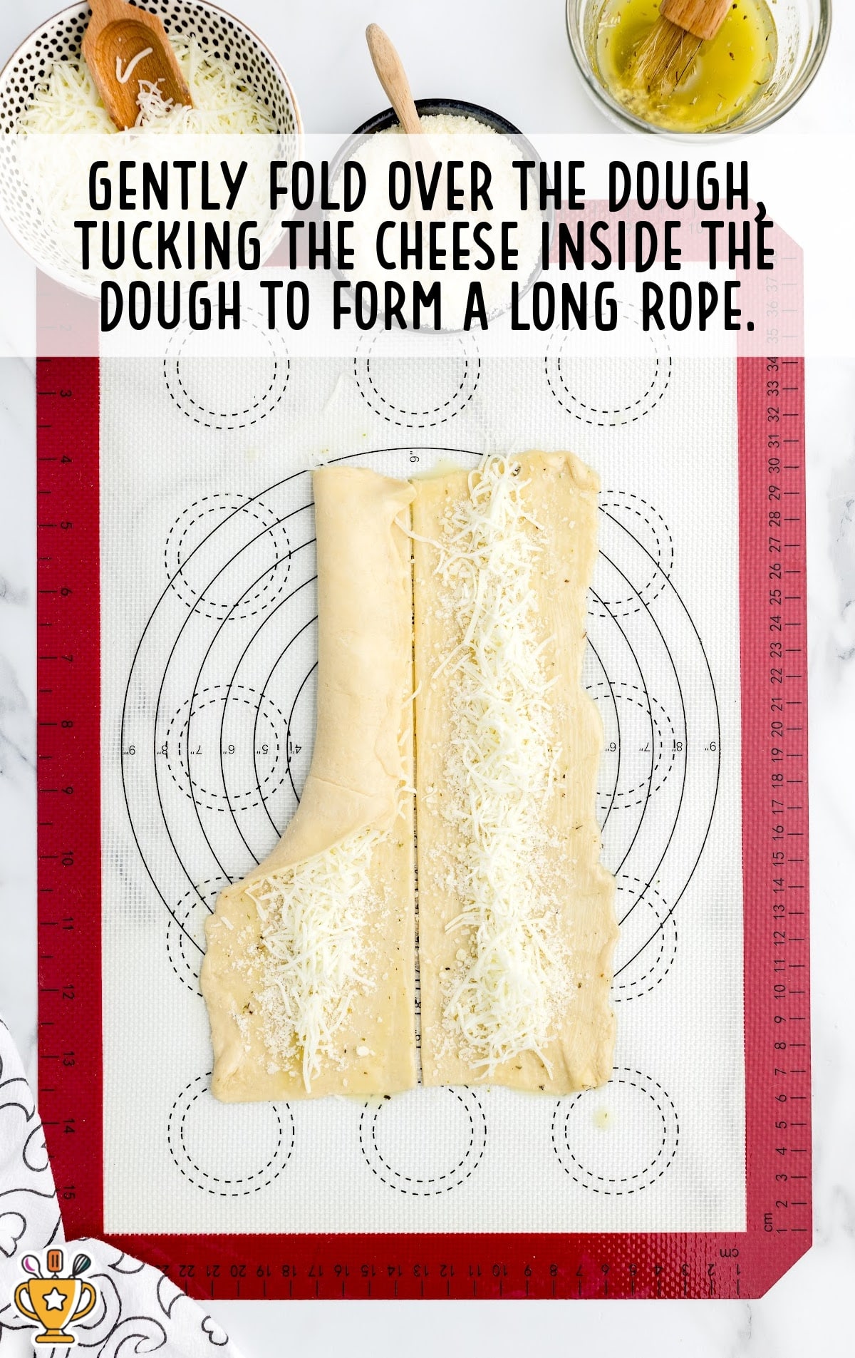 Dough rectangles folded over with cheese tucked inside, forming long ropes.