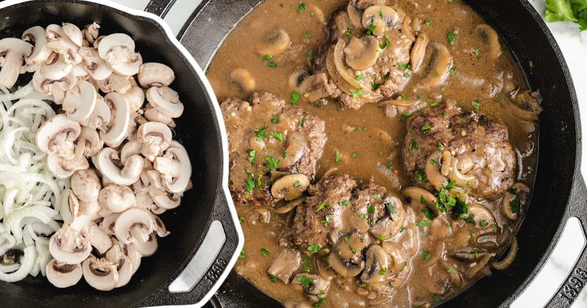 Split view of a skillet with raw sliced mushrooms and onions on one side and cooked hamburger steaks in gravy on the other side.